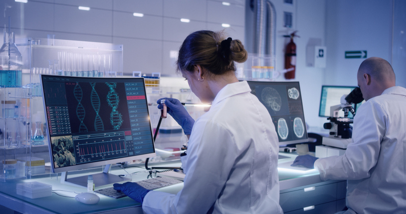 Photo shows research team studying DNA mutations/Getty images