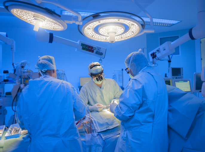 Photo shows surgeons performing open heart surgery/Getty Images