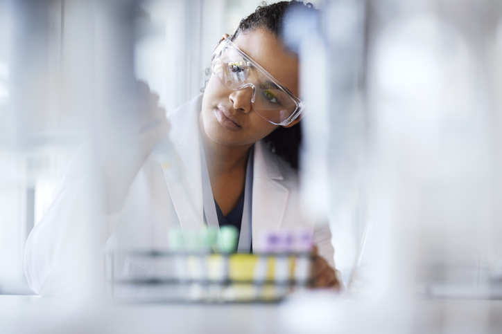 Photo shows a young female scientist working in a laboratory/Getty Images