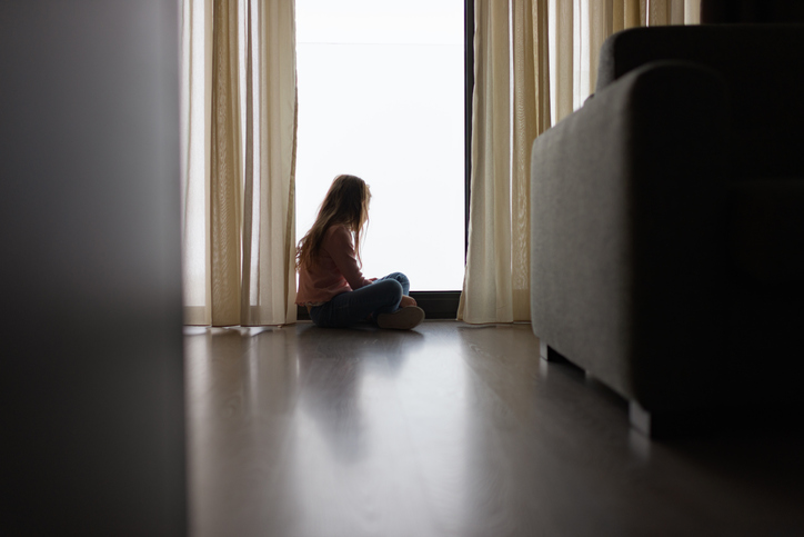 Photo shows Girl in profile in hospital room