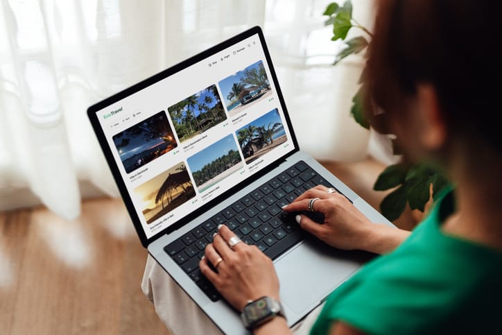 Photo shows woman using laptop