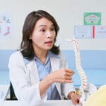 Photo shows Doctor explain bone mass density